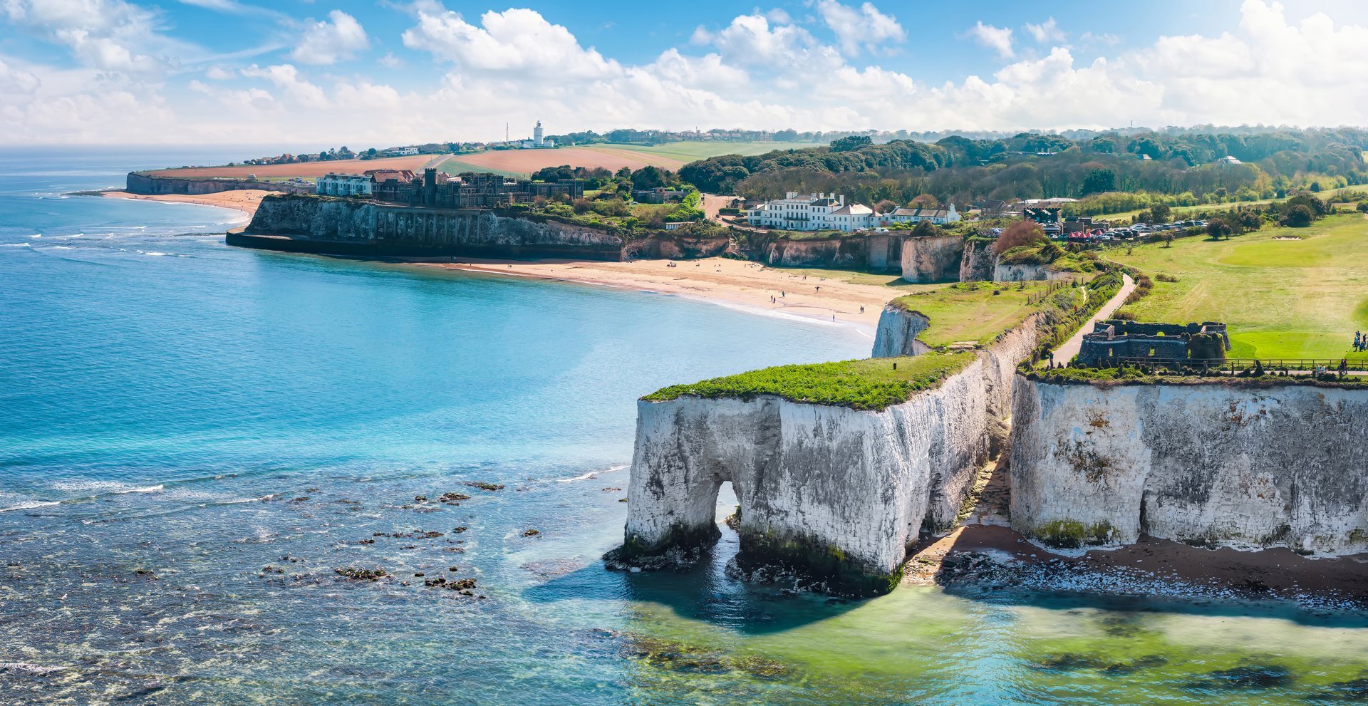 Aerial view of the beautiful Kingsgate Beach at the coast of Kent, England, with white chalk cliffs in the ocean