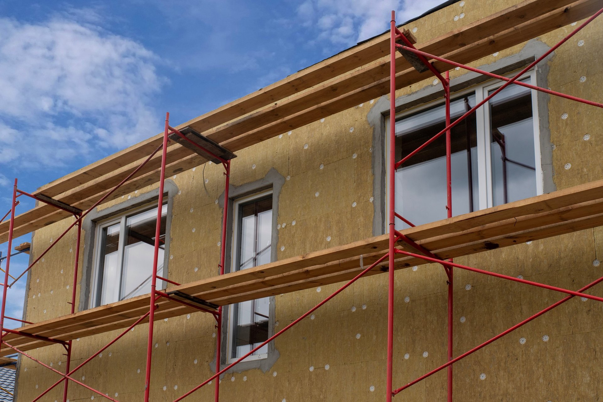 Facade insulation with mineral wool and scaffolding